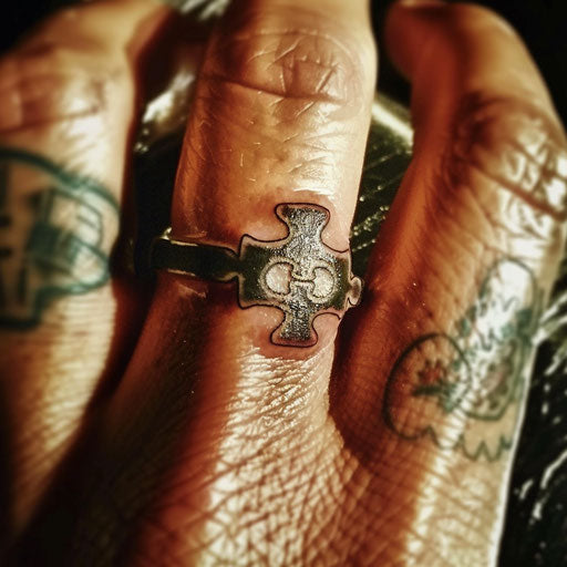 Matching puzzle pieces ring tattoo