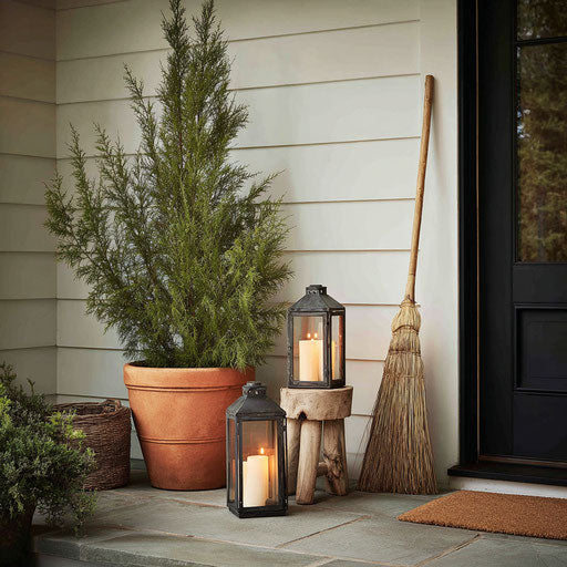 Evergreen Charm and Cozy Glow on the Porch