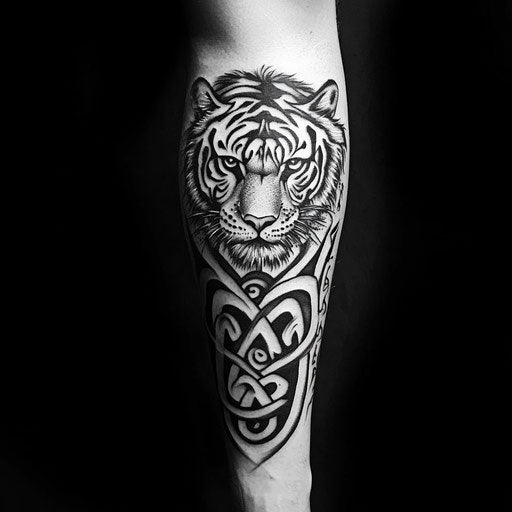 Tribal tattoos for men with a tribal tiger on the forearm