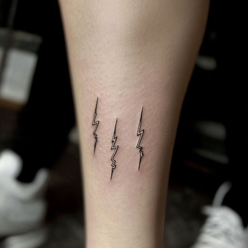 Small matching tattoos of tiny lightning bolts in the style of Humberto Ramos