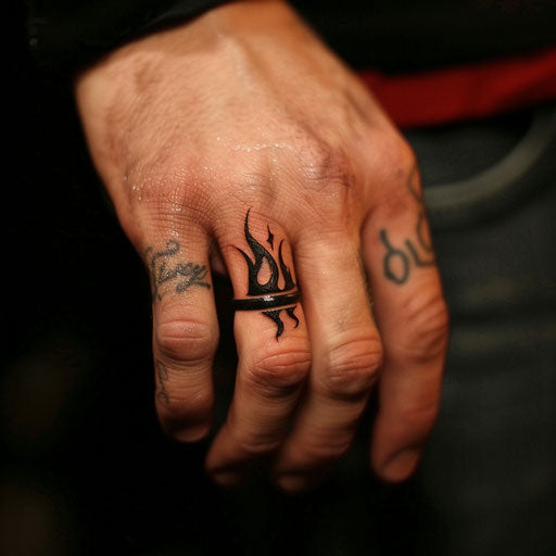 Wedding ring tattoo with small flame design