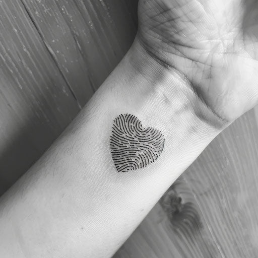 Stenciled black fingerprint heart on white