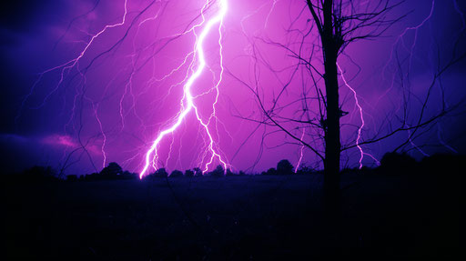 Purple lightning on black background, ektachrome style, intense lines 16:9