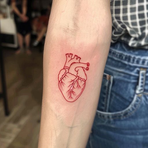 Minimalist sketch of a bright red heart tattoo