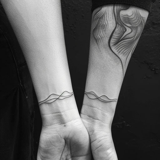 Matching minimalist line tattoos of sisters, on wrist