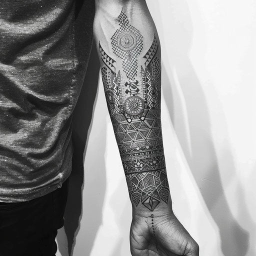 Intricate geometric arm tattoo design