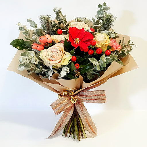 Winter flowers bouquet with bow and jingle bells