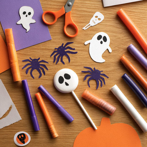 Scattered Halloween-Themed Items in the Image
