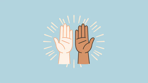 Unity in diversity with hands high fiving
