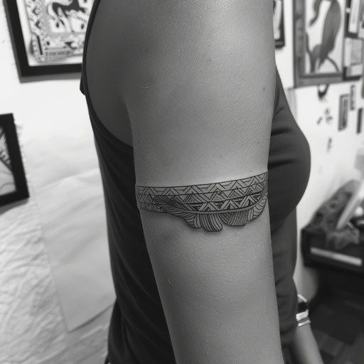 Feathers and tribal patterns tattoo bracelet on arm