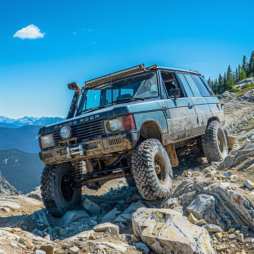 Elevated off-road vehicle navigating rocky mountains
