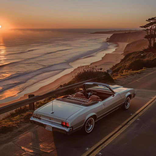 1976 Malibu Classic transformed into a classy convertible, driving on a beach road at sunrise