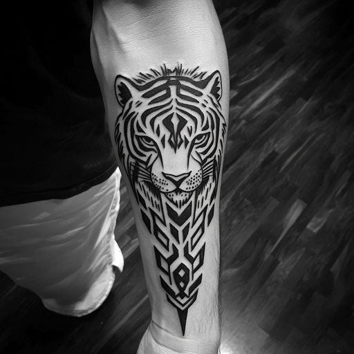Tribal tattoos for men featuring a tribal tiger stalking on the forearm