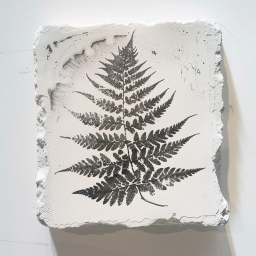 Rustic fern woodcut tattoo on white paper