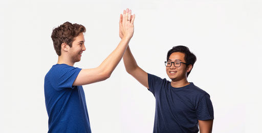 Two men high-fiving on white background