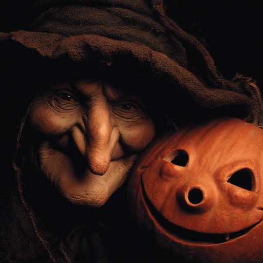 Cheerful jack-o'-lantern beside a witch in the night