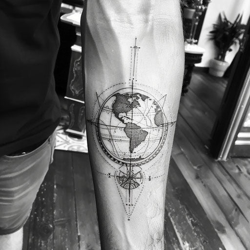 Monochrome tattoo sketch of Earth with detailed latitude and longitude lines