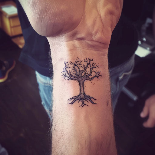 Men's wrist tattoos with Tolkien-inspired tree, Peter Jackson style